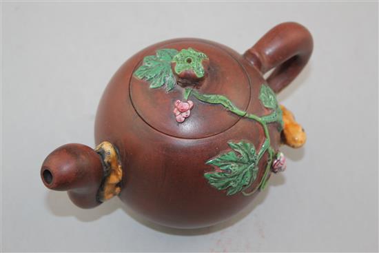 A Chinese Yixing enamelled pottery teapot, 20th century, 12cm.